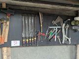 many tools hanging on the wall in the garage