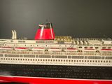 a model of a large cruise ship on a table