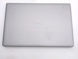 dell laptop computer sitting on a white surface with a logo on the screen