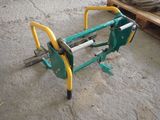 a picture of a green and yellow hand operated machine