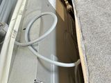 a person that is opening up a microwave in a box