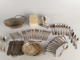 a lot of silverware and silverware on the table