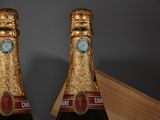 two bottles of champagne that are sitting on a table