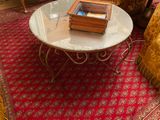 a glass table with books on it in a living room