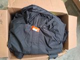 a box with a jacket in it sitting on the floor