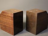 two pieces of wood that are sitting on a table