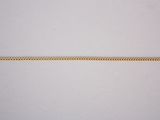 a close up of a gold chain on a white background