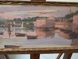 a picture of a painting on a easel with a boat in the water