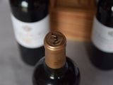 three bottles of wine sitting next to each other on a table