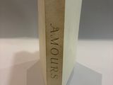 a book that is sitting on a table in front of a white background