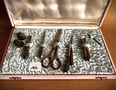 a box with a bunch of tools in it on a table