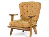 an image of a chair with a wooden frame and a patterned upholstered seat
