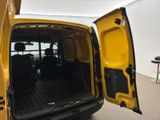 a yellow van with its doors open in a room
