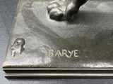 bronze statue of a man ' s foot on a plaque with the word barve