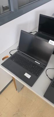two laptops that are sitting on a table