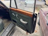 a car that has a door open on the side of the road