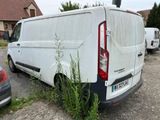 a van that has been vandalized and is parked in a parking lot