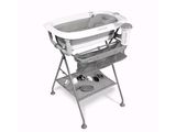 an image of a baby changing table with a baby in it