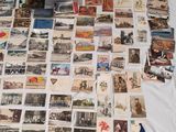 a lot of old postcards on the table