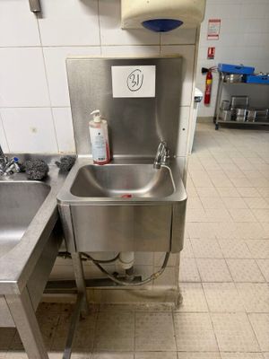 a stainless steel sink and a stainless steel sink in a kitchen