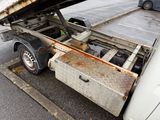 a truck that has a flat bed in the back of it