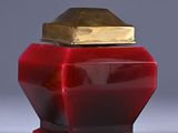 pair of red and gold vases sitting on top of a white table