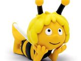 figurine représentant une abeille couchée sur le côté sur une surface blanche