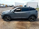 a grey suv that is parked in a parking lot