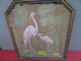une photo de deux flamants roses dans un cadre