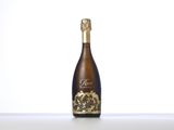 an empty bottle of wine sitting on top of a table
