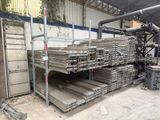 a large pile of metal items in a warehouse