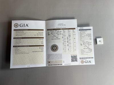 an open book with a picture of a coin on it