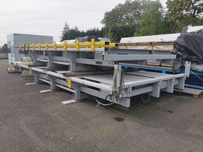 a close up of a flatbed trailer parked in a parking lot