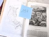 un livre ouvert sur lequel est collé un autocollant bleu