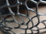 a close up of a metal bowl on a wooden table