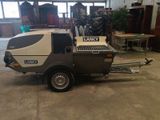 an image of a military vehicle in a garage