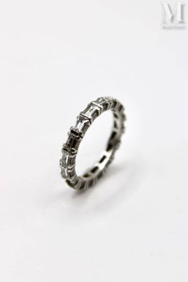 a close up of a ring on a white surface
