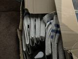 a cardboard box full of socks and socks on the floor