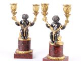 pair of bronze and red marble candlesticks with cherenshes