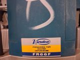 a blue machine with white writing on it in a store