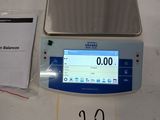 an image of a scale on a table with a price tag