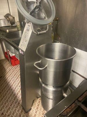 a large metal pot that is sitting in a kitchen