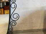 a mirror that is sitting on the floor in front of a wall