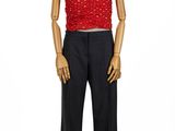 female mannequin with red top and black pants on a white background