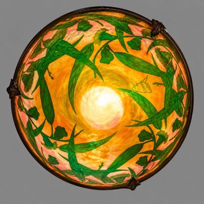 a picture of a bowl that has a painting of people on it