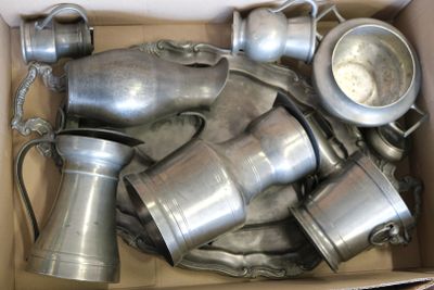 a cardboard box full of old metal items in it