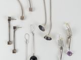 many different types of spoons and spoons hanging on a wall