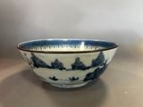 a blue and white bowl sitting on a table