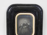 a black and white photo of two women in a black frame