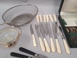 many different types of silverware and silverware on the table